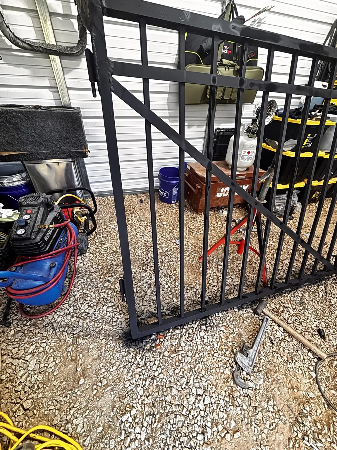 Custom fabricated steel gate during shop work