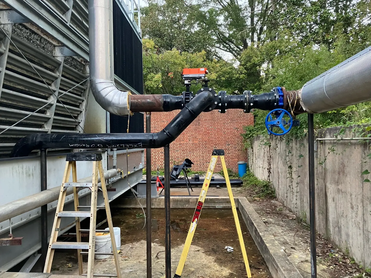 Outdoor industrial piping retrofit with valves and fabricated offsets